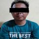 SGY (39) tak berdaya setelah ditangkap polisi. Ia ditangkap atas laporan kepemilikan senjata api jenis pistol oleh istri sendiri