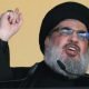 Foto: Pemimpin Hizbullah Sheik Hassan Nasrallah berbicara kepada khalayak selama hari suci Asyura, di pinggiran selatan Beirut, Lebanon. (AP/Hassan Ammar/File Foto)