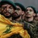 Foto: Militan Hizbullah berparade di pinggiran selatan Beirut. Foto- Marwan Naamani/dpa/Getty Images