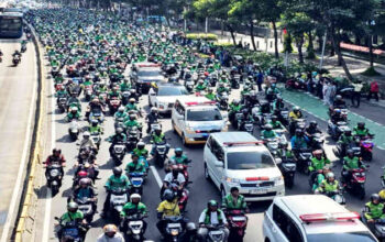 “Potongan Ojol Dipangkas Jadi 8%: Berkah Buruh atau Mimpi Buruk Aplikator?”